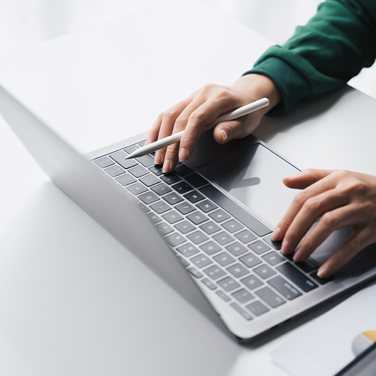 hands on a laptop keyboard